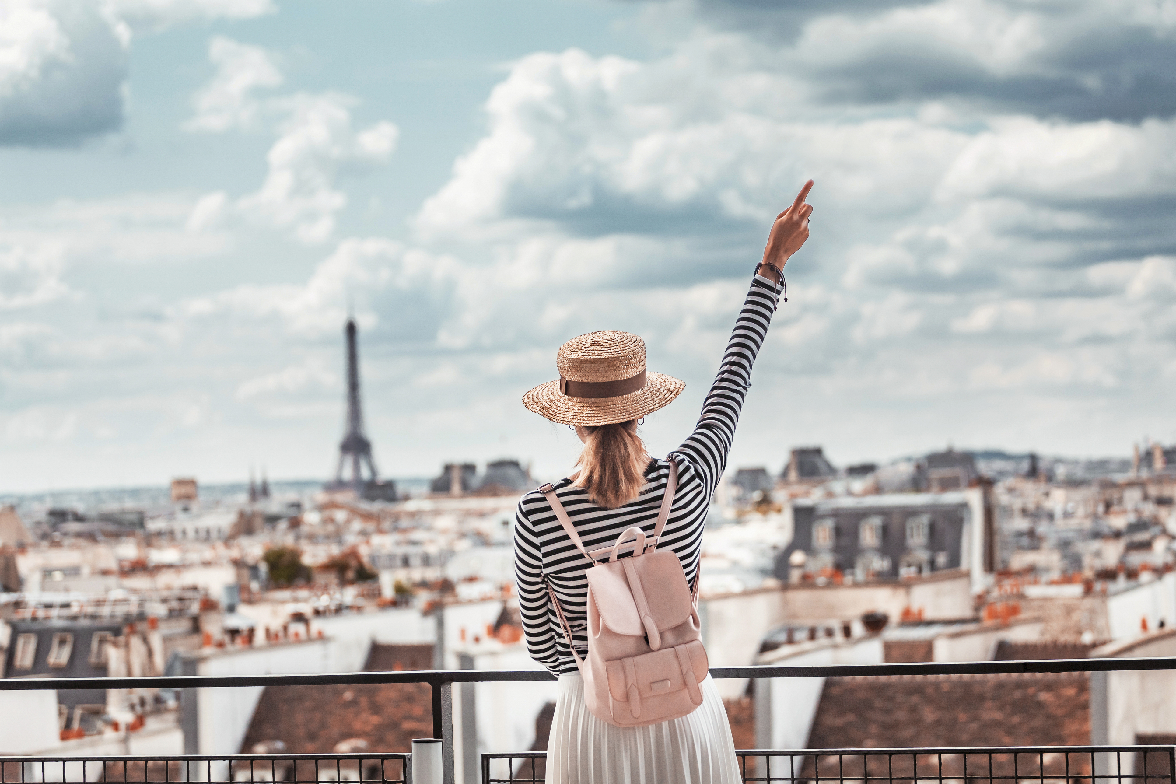 Study abroad in France with The Experiment to discover its diverse cultures and regions—from Paris to a border community and its neighboring country. High school study abroad in Europe with The Experiment in International Living. Girl enjoys a grand view of Paris from the observation deck