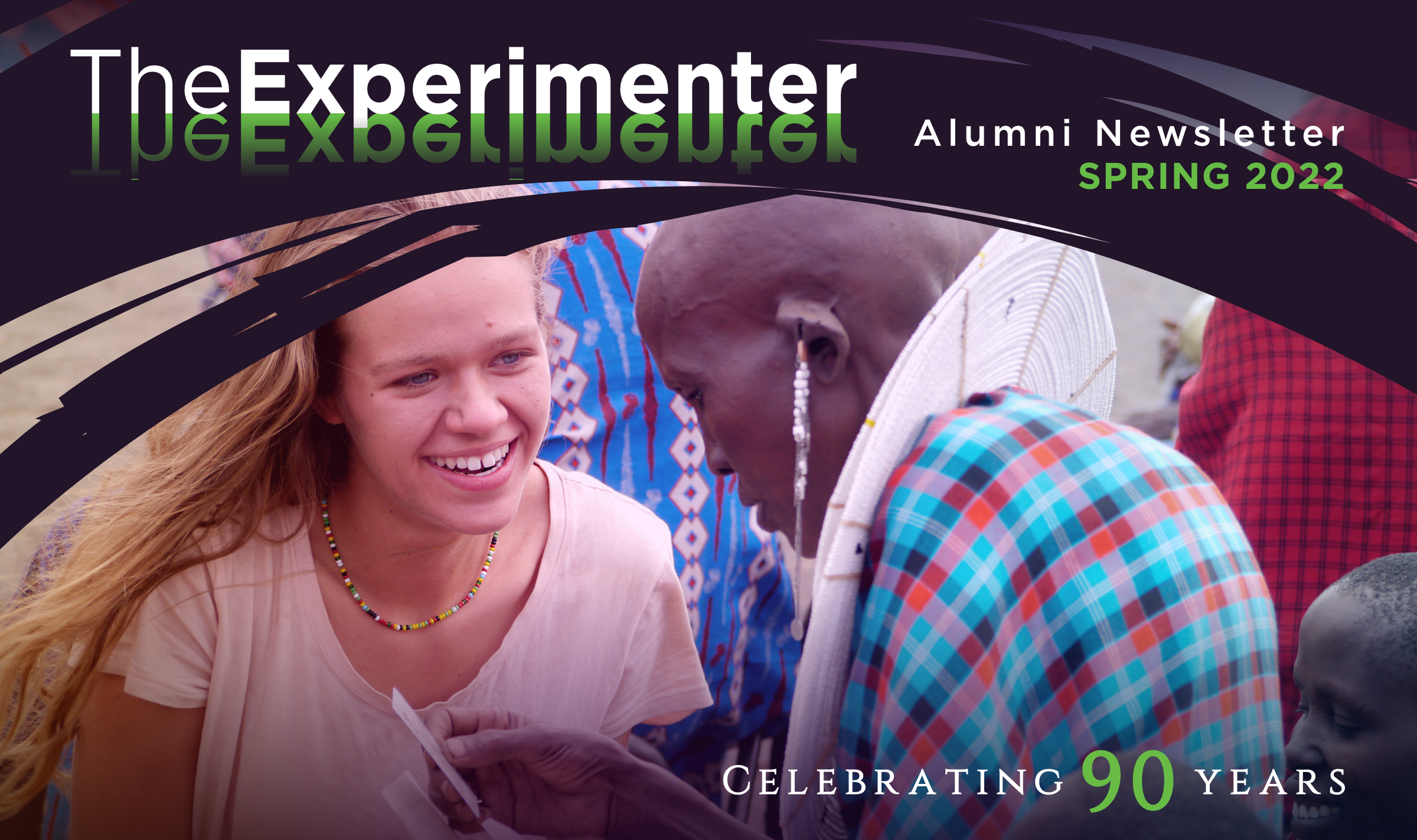 TheExperimenter cover image, student talking and smiling with Maasai tribe member