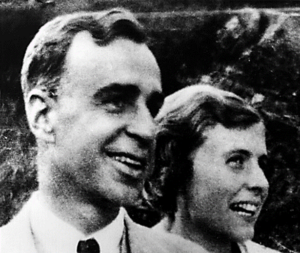 A black and white photo of a man and a woman's profiles side by side as they look to the side.